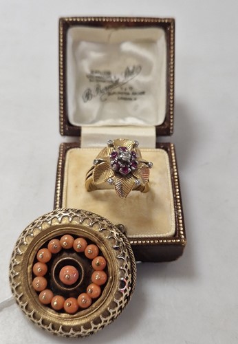 Lot 321 - A ruby and diamond cluster ring, tested as...