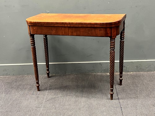 Lot 577 - George III mahogany card table with carved...