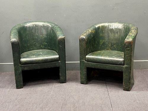 Lot 573 - A near pair of 20th century green leather...