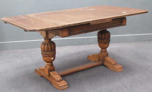Lot 558 - A late 19th century oak draw leaf extending...