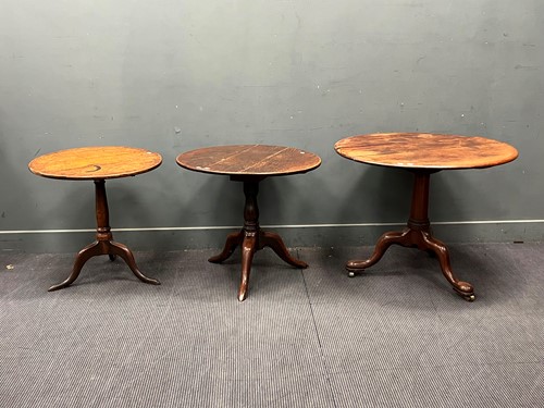 Lot 570 - An early 19th century oak tripod table, three...