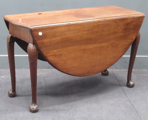 Lot 567 - A George III style mahogany oval drop leaf...