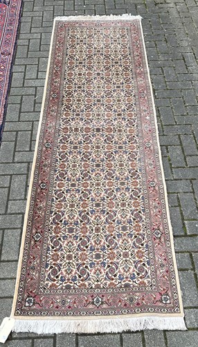 Lot 708 - A Caucasian cream ground runner 299cm x 82cm