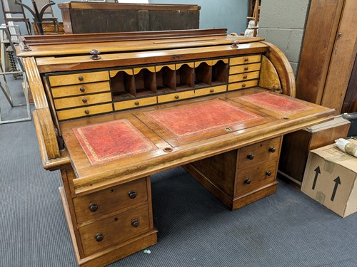 Lot 560 - A Victorian mahogany roll top desk, with...