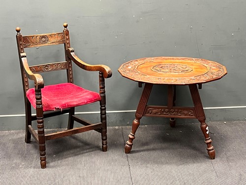 Lot 651 - A polygonal table set on three carved legs,...