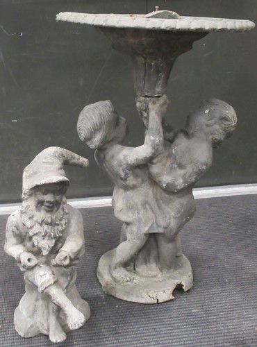 Lot 693 - A lead bird bath supported by a pair of...