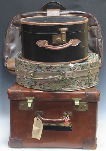 Lot 88 - A large square leather suitcase by H J Cave...