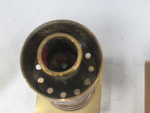 Lot 27 - A pair of Regency brass candle holders or...