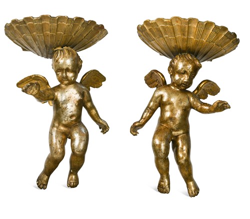 Lot 456 - A pair of gilt gesso and carved wood cherubic wall brackets