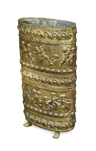 Lot 471 - A brass oval repousse stick stand, late 19th century