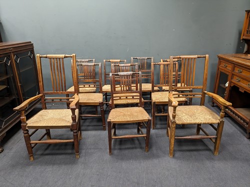 Lot 520 - Eight stained-ash chairs with rush seat, with...