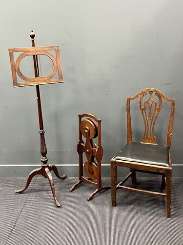 Lot 552 - A George III style mahogany music stand on...
