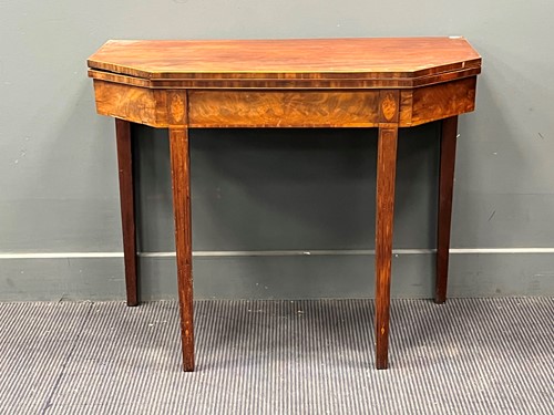 Lot 496 - A George III line inlaid mahogany card table...