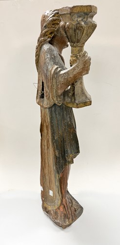 Lot 17 - A French carved and polychrome painted figure of a saint, mid-17th century