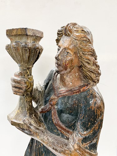 Lot 17 - A French carved and polychrome painted figure of a saint, mid-17th century