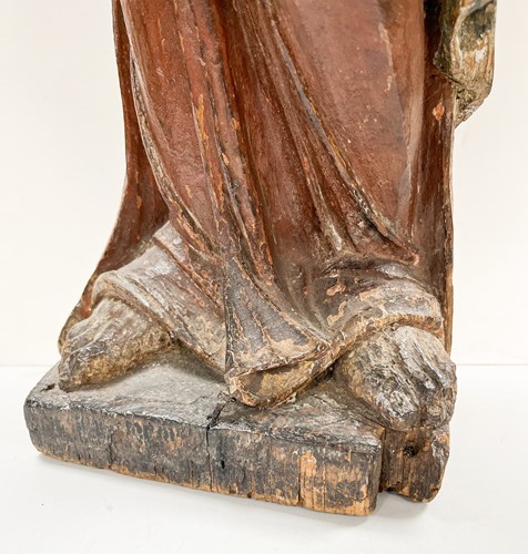 Lot 17 - A French carved and polychrome painted figure of a saint, mid-17th century
