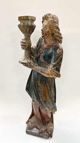 Lot 17 - A French carved and polychrome painted figure of a saint, mid-17th century