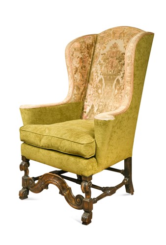 Lot 601 - A carved walnut-framed wingback armchair, 17th century