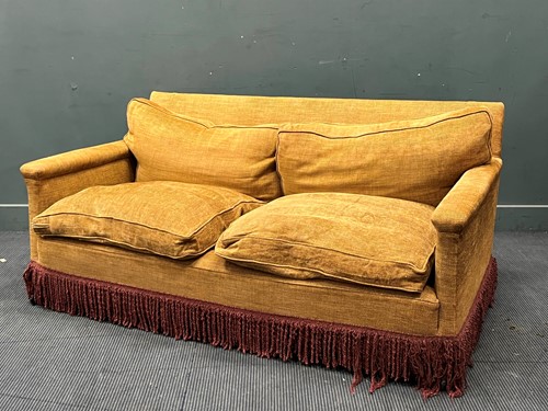 Lot 483 - A brown sofa with fringe 74 x 172 x 97cm
