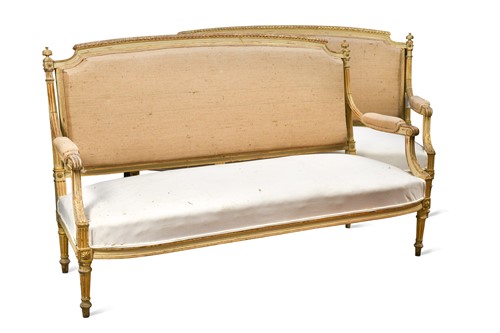Lot 625 - A pair of French Louis XVI style painted and parcel-gilt settees, 19th century