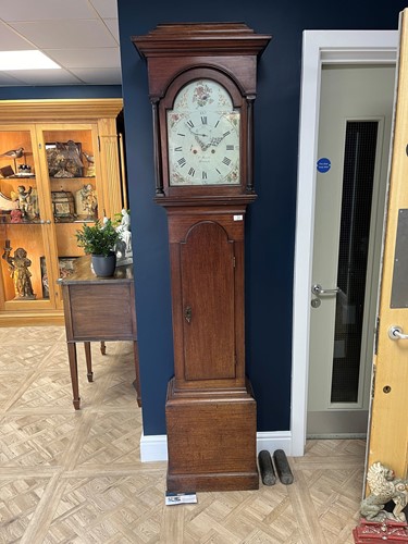 Lot 662 - A Mahogany painted arched dial long case clock...