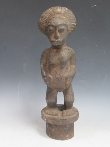 Lot 157 - A West African carved wood figure, probably...