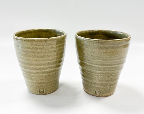 Lot 23 - David Leach OBE (1911-2005), a pair of celadon glazed stoneware tumbler cups
