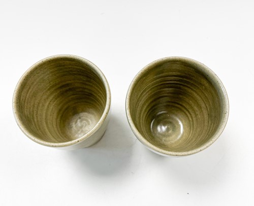 Lot 23 - David Leach OBE (1911-2005), a pair of celadon glazed stoneware tumbler cups
