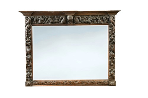 Lot 457 - A carved oak overmantel mirror, incorporating 18th century elements