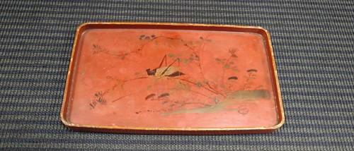 Lot 17 - A Chinese red lacquered tray; a model Buddha;...
