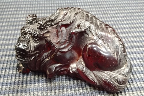 Lot 17 - A Chinese red lacquered tray; a model Buddha;...
