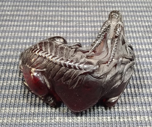 Lot 17 - A Chinese red lacquered tray; a model Buddha;...