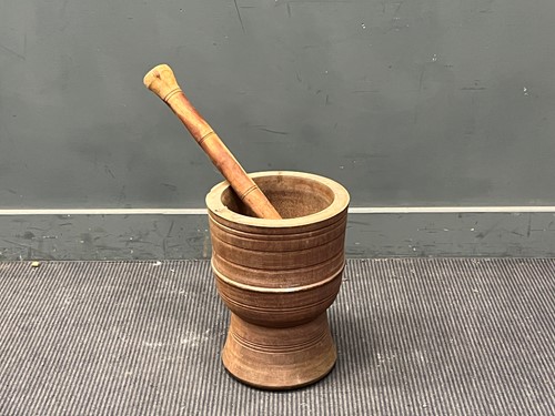 Lot 126 - A large rustic turned wood pestle and mortar....