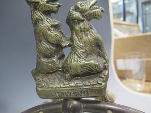 Lot 23 - A reproduction bronze female figure on a swing...