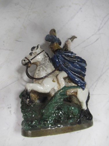 Lot 23 - A reproduction bronze female figure on a swing...