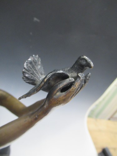 Lot 33 - A modern bronze model of a draped young woman...
