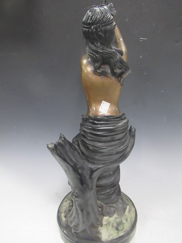 Lot 33 - A modern bronze model of a draped young woman...