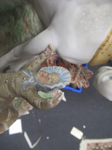 Lot 6 - A painted bisque family with horse figure...