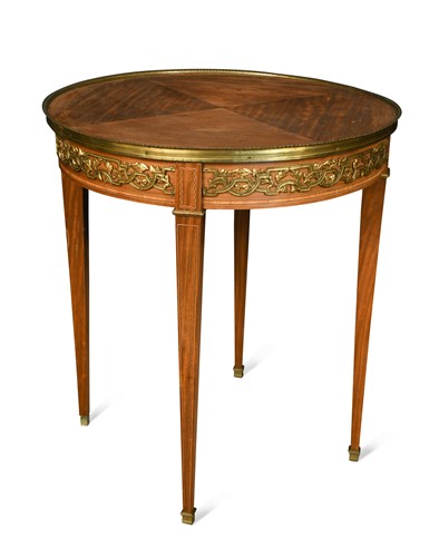 Lot 543 - A Louis XVI style satinwood and gilt metal mounted centre table