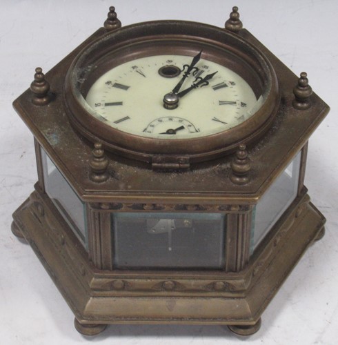 Lot 55 - A 20th century hexagonal brass cased table...
