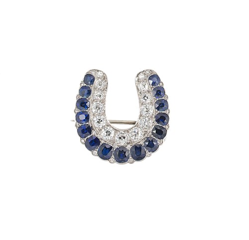 Lot 166 - A sapphire and diamond horseshoe brooch