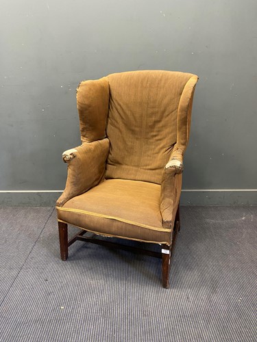Lot 300 - A mahogany frame wingback armchair, 19th century