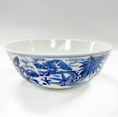 Lot 36 - A Chinese blue and white porcelain dragon bowl, Qing Dynasty, 19th century