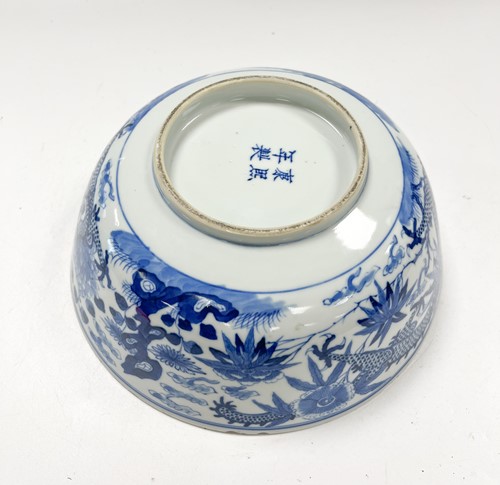 Lot 36 - A Chinese blue and white porcelain dragon bowl, Qing Dynasty, 19th century
