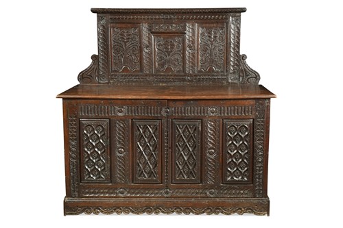 Lot 641 - A carved and panelled oak hall cupboard with raised back, 17th century and later