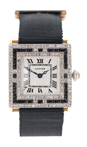 Lot 252 - Cartier - An Art Deco French platinum and 18ct gold diamond and onyx set wristwatch
