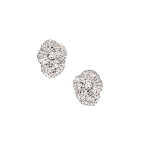 Lot 152 - A pair of diamond set swirl style ear clips