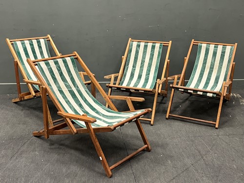 Lot 684 - A matching set of four hardwood deck chairs...