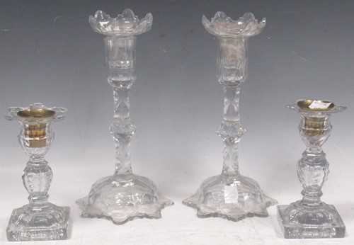 Lot 59 - A pair of George III cut glass candlesticks...