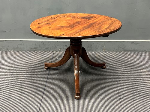 Lot 642 - A low mahogany tripod table, 19th century and...